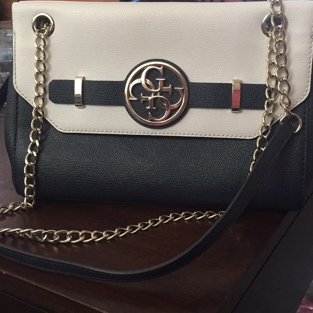 White and navy Guess clutch worn once still new